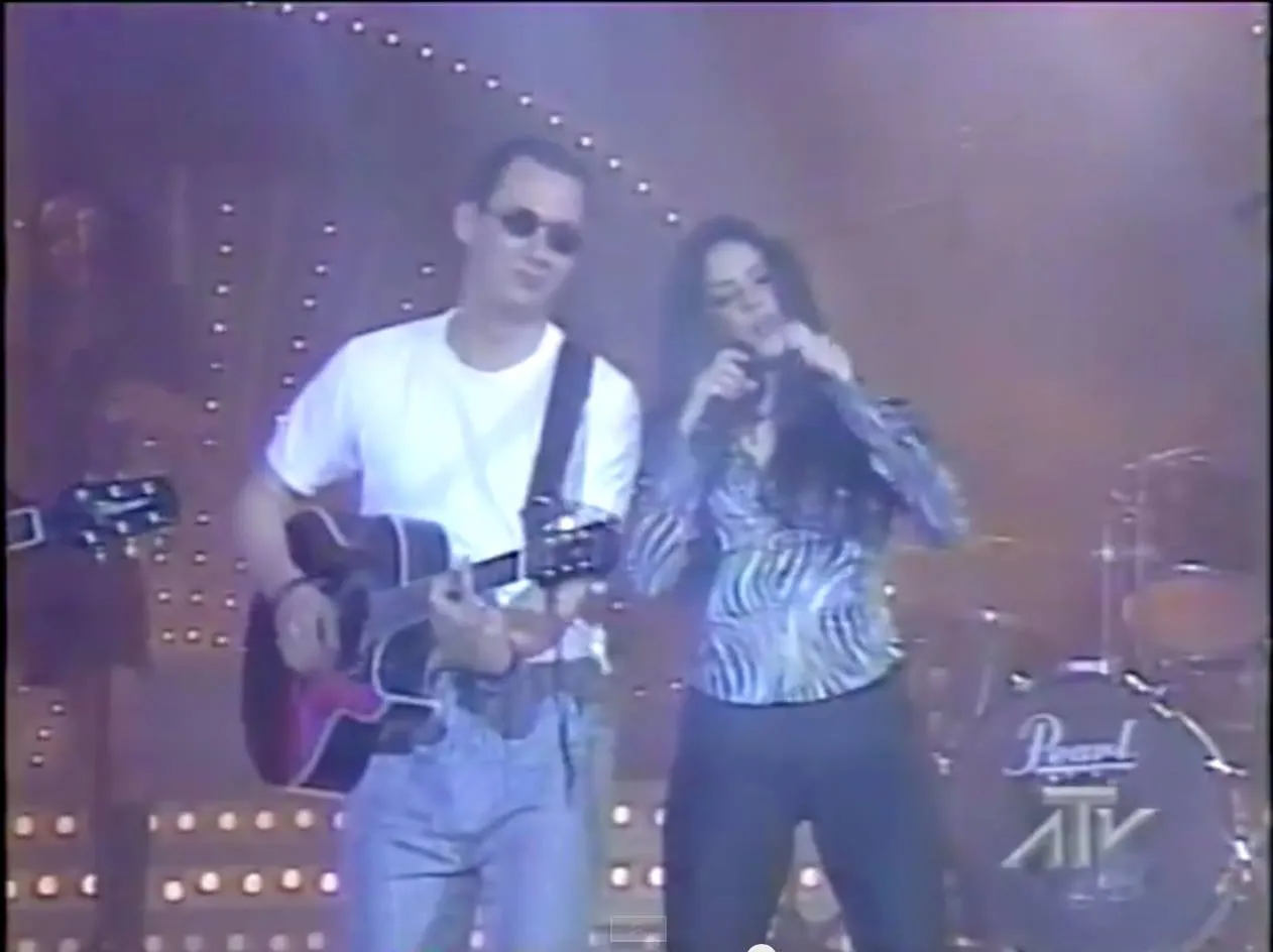 Black-and-white archival photo of Luis Giraldo with Shakira, circa 1996